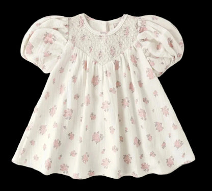 Floral baby dress on a white background
