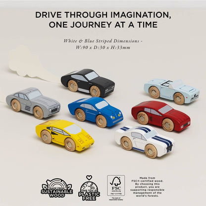 Seven Classic Wooden Sports Cars by Le Toy Van, Inc. are displayed on a light surface with a cloud backdrop. The cars include train track compatible vehicles. Text above says, Drive through imagination, one journey at a time.
