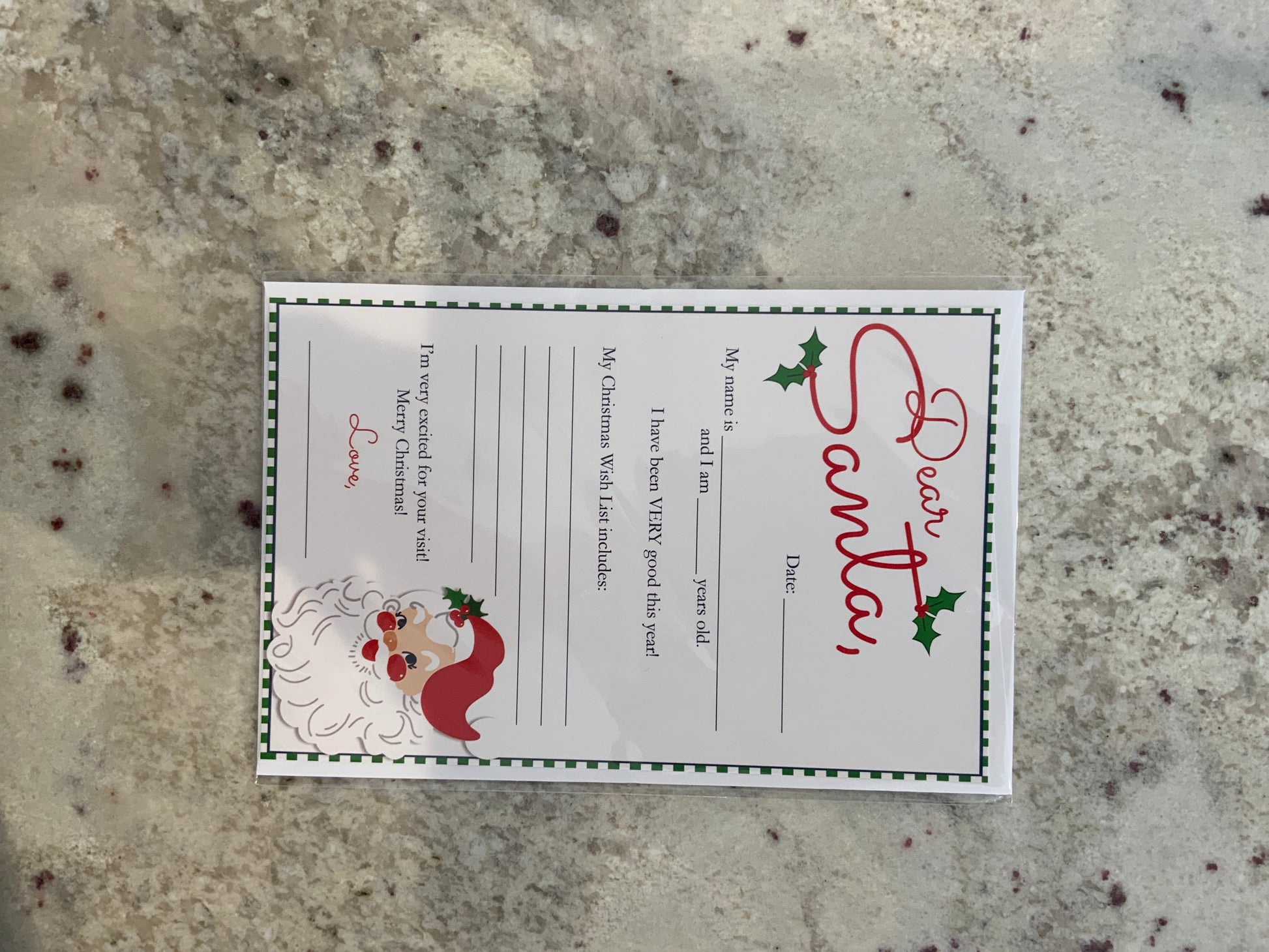 The Cottontail Dear Santa letter template features a cartoon Santa face, holly accents, and fill-in sections for child's name, age, good deeds, wish list, and a closing message—perfect for festive countertop displays.