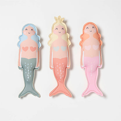 Three mermaid-shaped summer dive toys  in pastel colors on a white background