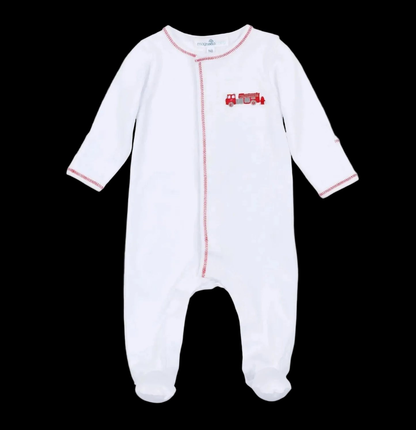 The Magnolia Baby To the Rescue Footie is a white, long-sleeve baby onesie featuring red stitching and an embroidered red fire truck on the chest, shown against a black background.