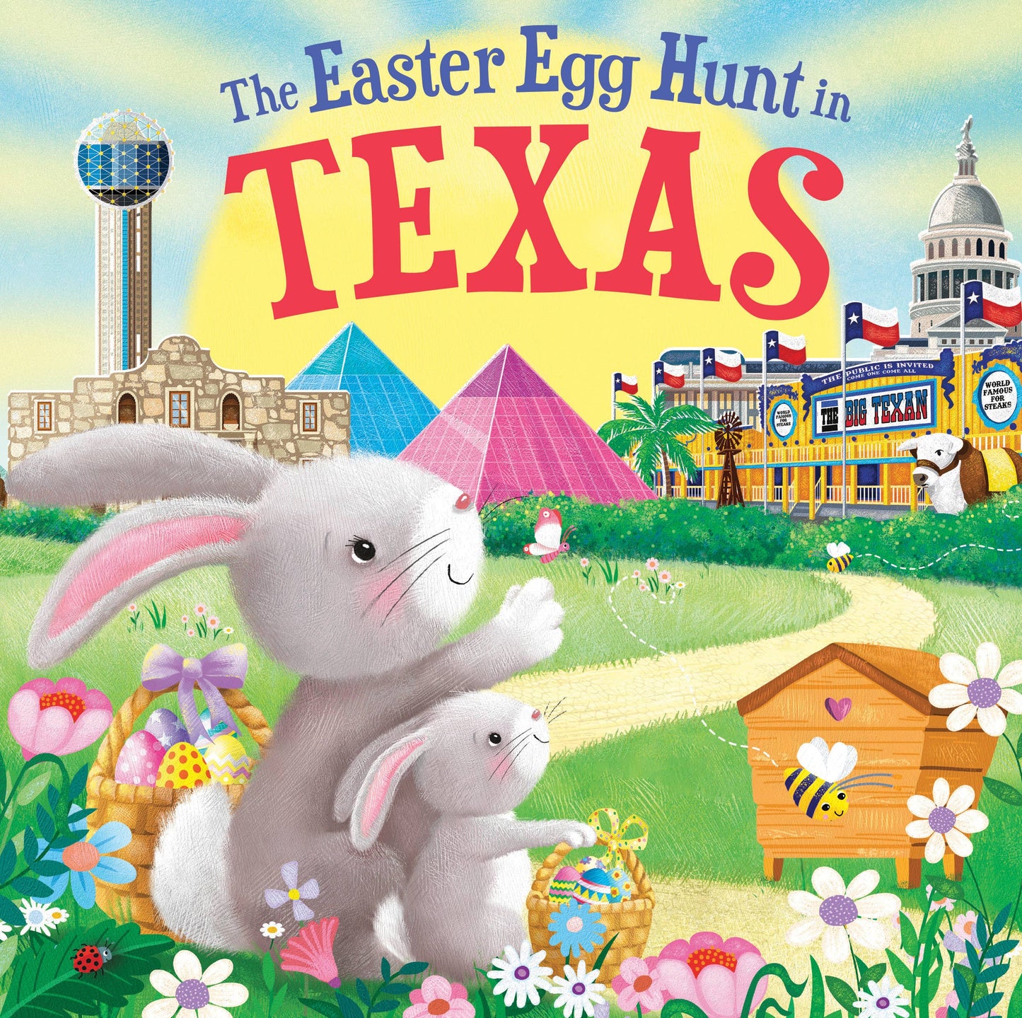 Two bunnies with Easter eggs sit in a meadow with Texas landmarks and a bright sky. "The Easter Egg Hunt in Texas" by Sourcebooks is the perfect Easter read-aloud children’s book and a delightful basket stuffer.