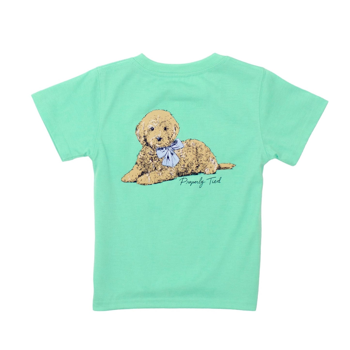 The Girls Doodle SS Wash Green tee by Properly Tied is crafted in soft pima cotton and features a tan puppy with a blue bow lying down, with “Properly Tied” printed below the charming illustration.