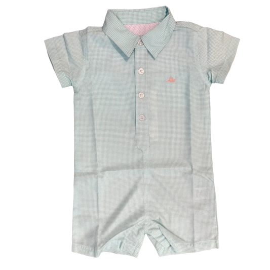 Light blue checkered baby romper on a wooden surface