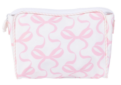 The Large Go Bag by Apple Of My Isla is a white eco-friendly zippered pouch with light pink bow patterns—a charming and practical choice.