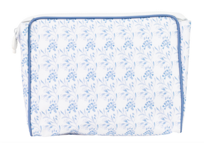 The Large Go Bag by Apple Of My Isla features a white background with light blue floral patterns and blue piping. This eco-friendly, rectangular zippered pouch is both stylish and sustainable.