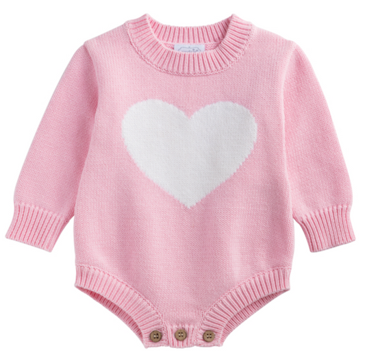 The mudpie Pink Love Sweater Bubble is a long-sleeve baby knit with ribbed cuffs, a white heart on the chest, and three brown bottom buttons for easy fastening. Perfect for infants aged 0-3 months.