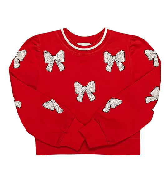 Red sweater with white bow patterns on a white background