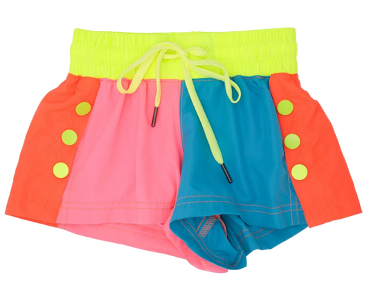 Colorful children's swim shorts with a green waistband and yellow buttons on a white background