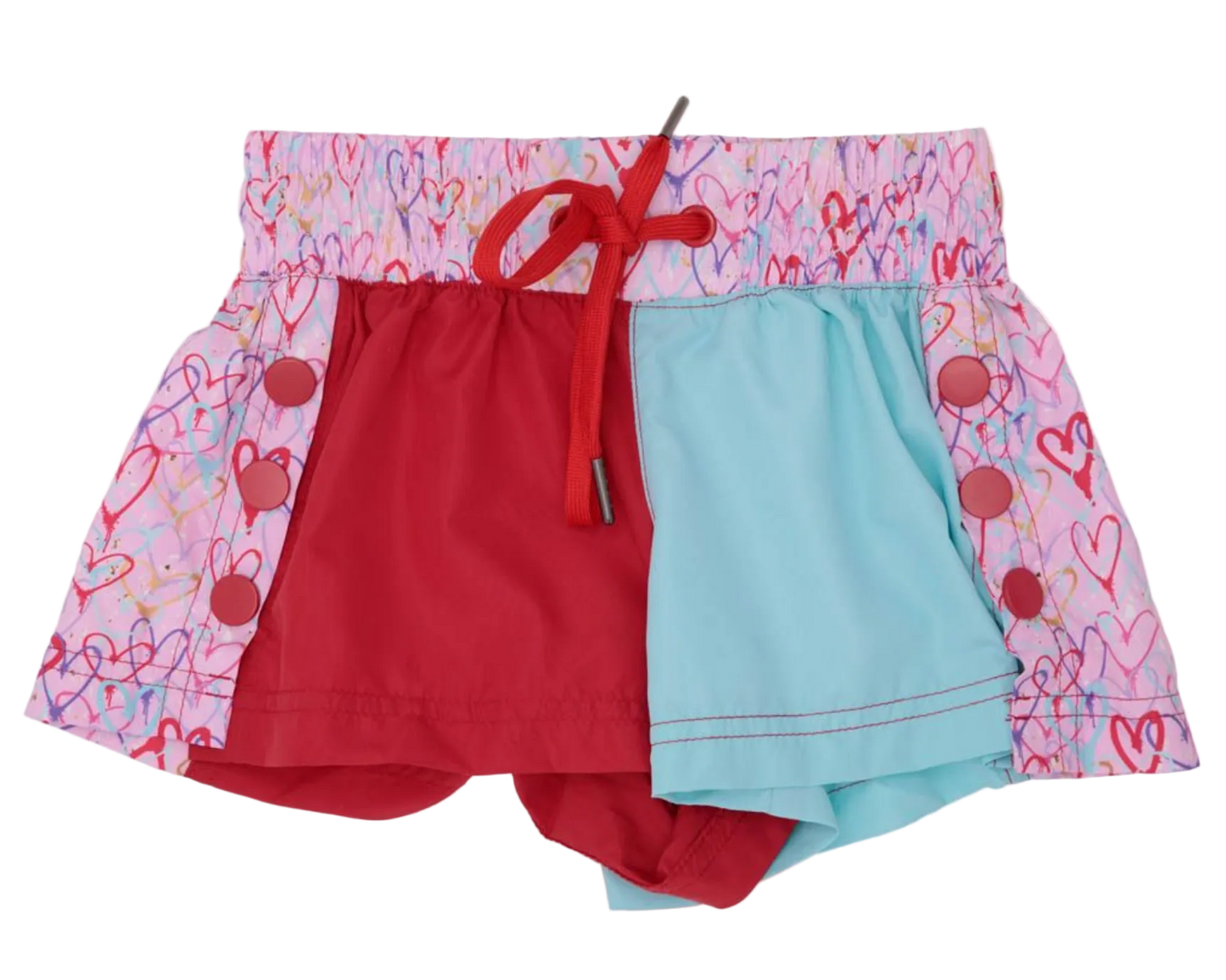 The Azarhia Heart Collage Color Block Shorts feature a pink waistband and sides with a heart print, a red front left panel, light blue right panel, and red drawstring—perfect playful style for Valentine's Day!.
