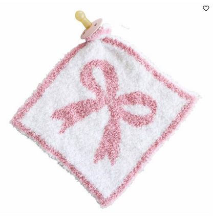 The CuddleLane™ Luxe Lovey | Bows by Caden Lane is a white and pink security blanket featuring a bow design center and a pacifier holder for baby's comfort.