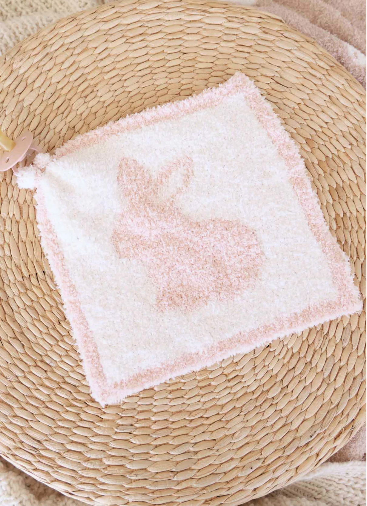The CuddleLane™ Luxe Lovey | Bunny Foo Foo by Caden Lane is a soft square washcloth with a pink bunny design and border, ideal as a plush comfort item for your baby.