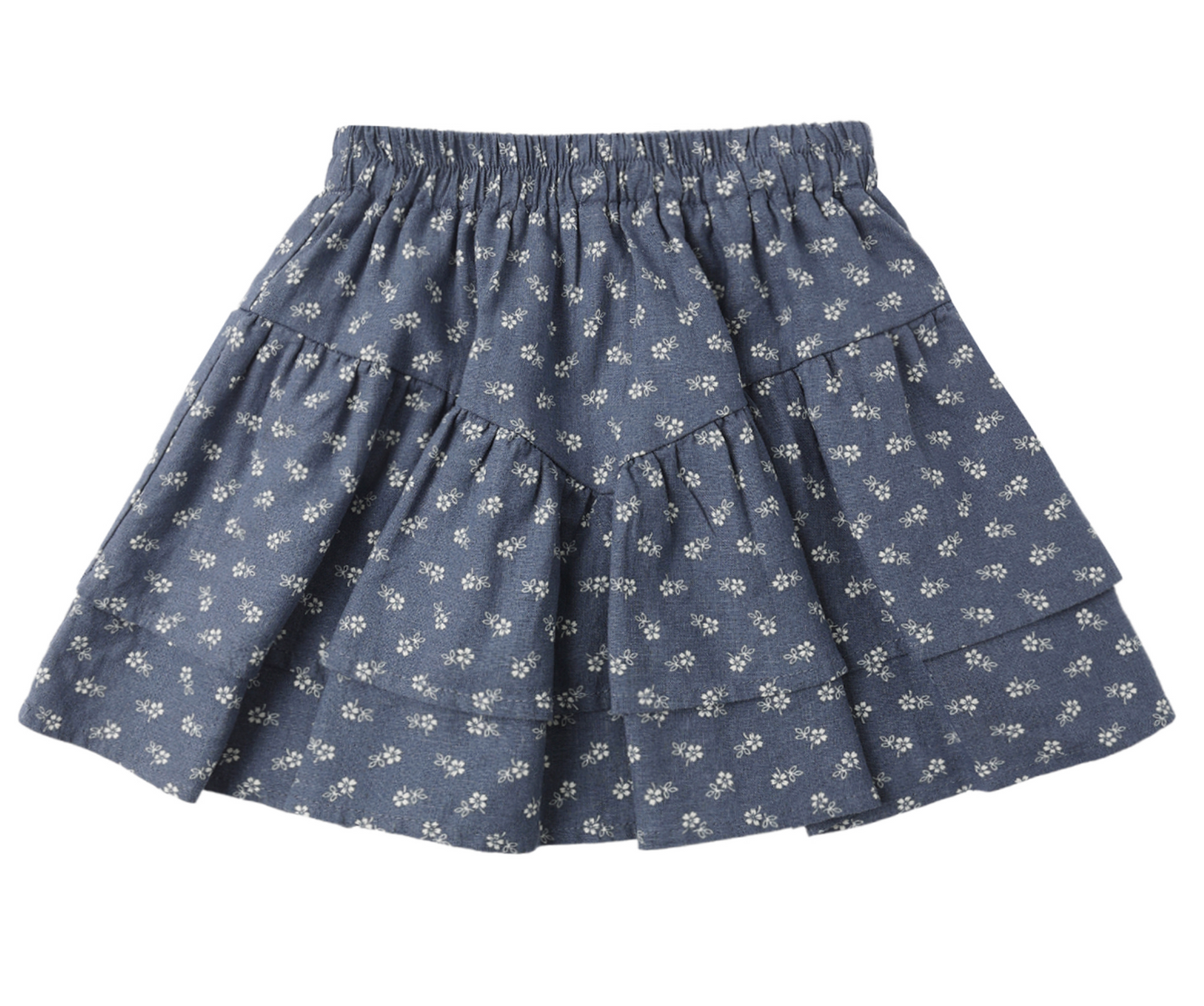 The Rylee & Cru Tiered Mini Ditsy Skirt is a lightweight dusty blue skirt with ruffled tiers, an elastic waistband, and small white floral patterns, shown on a white background.