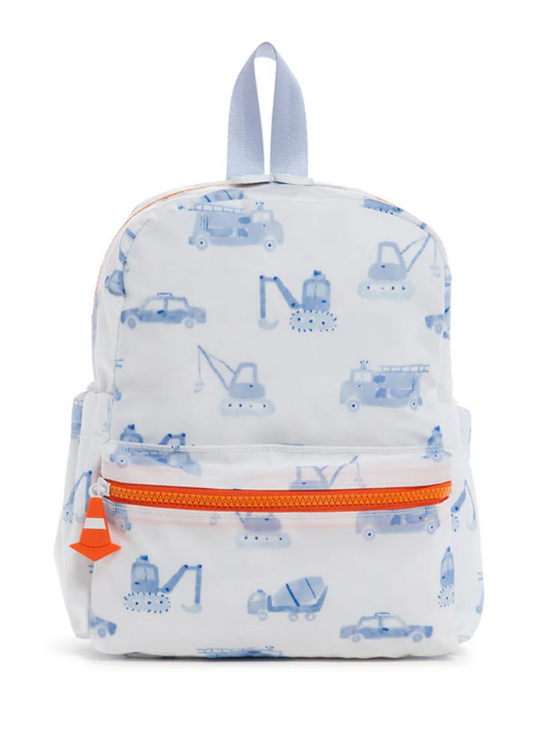The TRVL Mini Backer by TRVL is a small, washable kids backpack featuring light blue construction vehicle prints, an orange zipper, side pockets, and a gray top handle.