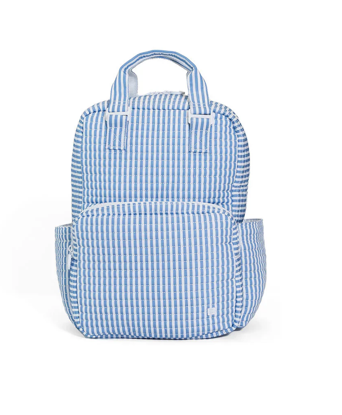 The TRVL QUILTED ALL YOU NEED BAG by TRVL is a machine washable backpack with a blue and white vertical stripe design, two top handles, a front zippered pocket, and two side pockets, shown against a white background.