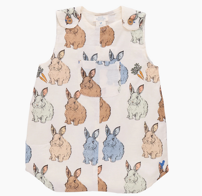 The Vintage Bunny Noah Jumper by Pink Chicken is a sleeveless baby boy's romper with a brown, gray, blue, and white bunny print, carrots, and butterfly details. Features a front pocket and snap shoulder closures—perfect for Easter!.