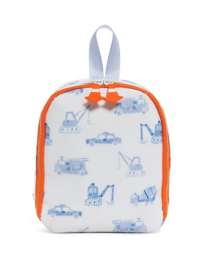The TRVL Bring It Lunch Bag by TRVL is a small white insulated bag with orange zippers, a gray top handle, and blue trucks and cranes printed all over.
