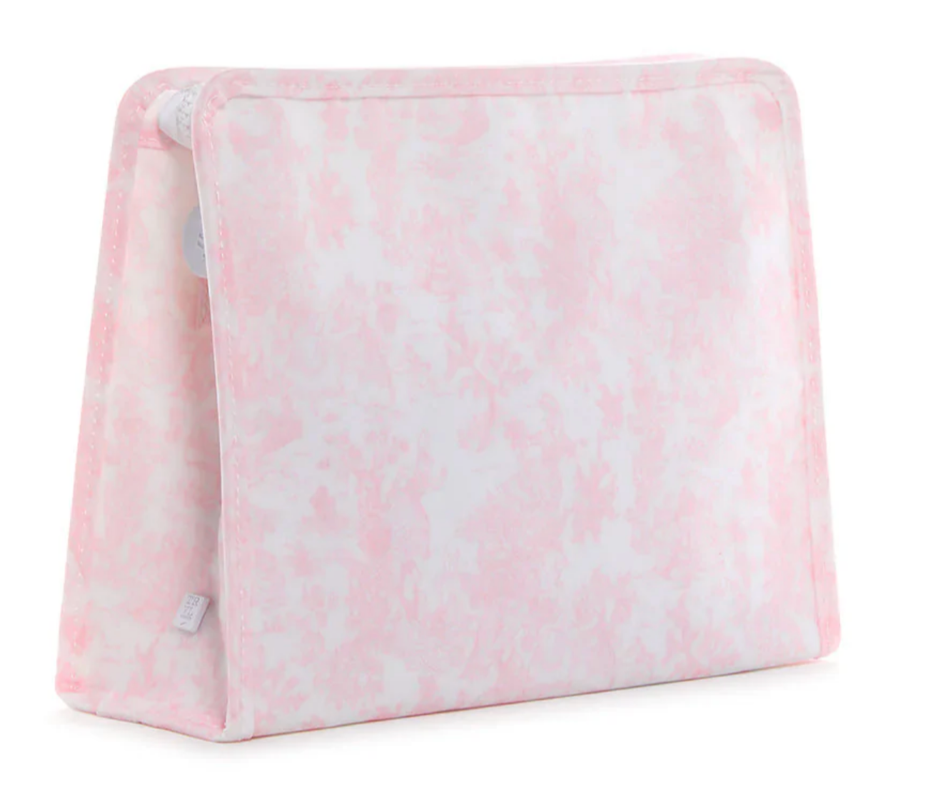 A soft, triangular foam wedge pillow in pale pink and white pattern stands upright with rounded edges—perfect to pair with the TRVL Large Roadie Bag by TRVL for added comfort and organization on your travels.