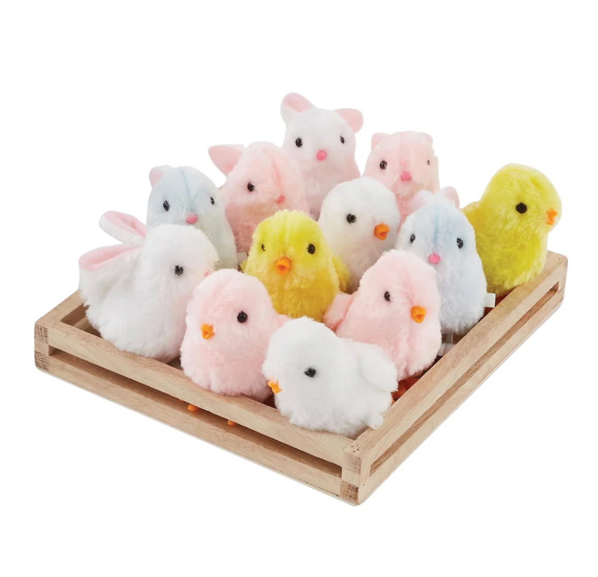 A wooden tray displays mudpie Wind Up Chicks and Bunnies in pastel yellow, pink, and white, arranged neatly in rows.