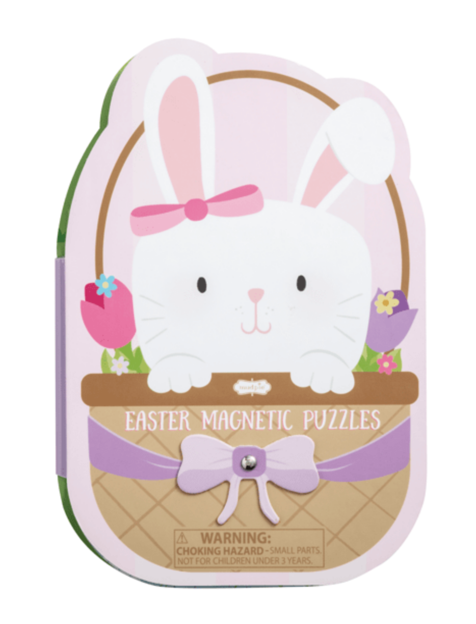 A pastel bunny-shaped box from mudpie, decorated with flowers and a purple bow, holds the Easter Magnetic Easter Puzzle Book. The box features magnetic puzzles and a warning label at the bottom.