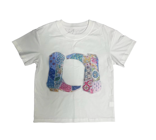 The Patchwork Boots Short Sleeve Tee by Tweenstyle by Stoopher features a bold, colorful patchwork D and J design on a white T-shirt, adding classic Western-inspired flair to any outfit.
