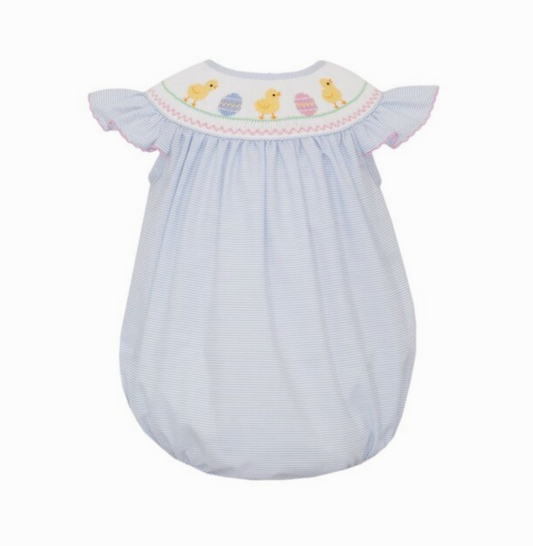 The Petie Bebe Easter Chicks Angel Wing Bishop Bubble features light blue fabric, white and yellow duck embroidery on the yoke, pink-trimmed ruffled sleeves, and gathered shoulders and hem.