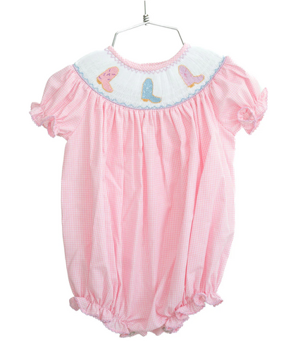 The Ruth & Ralph Cowgirl Boots Smocked Birdie Bubble features pink gingham, puffed sleeves, ruffled edges, pastel bird embroidery, and blue-trimmed white collar. Adorable for your little one—just add tiny cowgirl boots!.