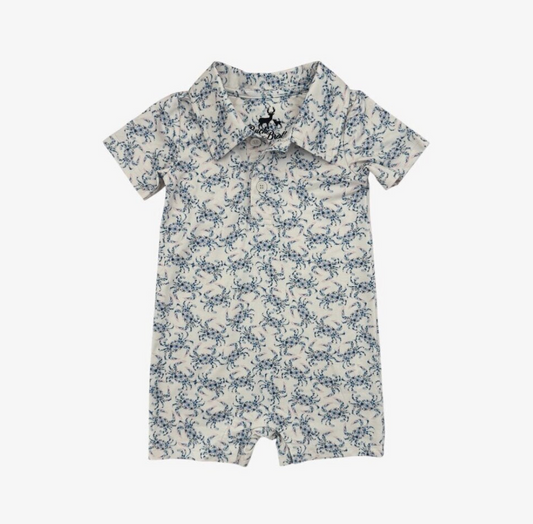 Baby romper with blue floral crab pattern on a white background