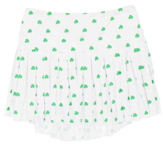 white mini pleated Azarhia skort with miniature green shamrocks printed all over. 