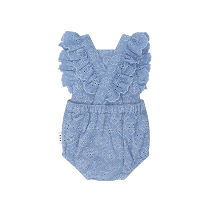 Blue lace baby romper on a light pink background