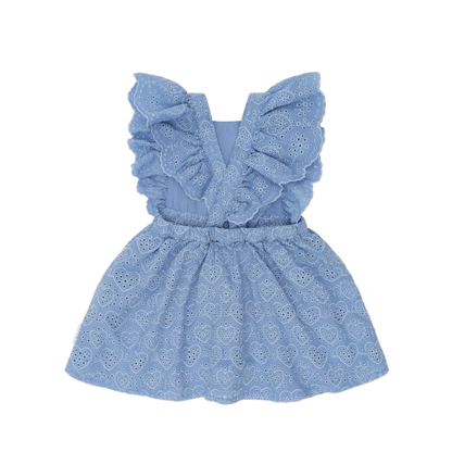 Blue lace dress with ruffled details on a light pink background
