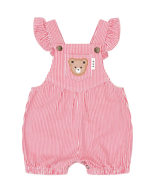Red and white striped baby romper with bear design on a beige background
