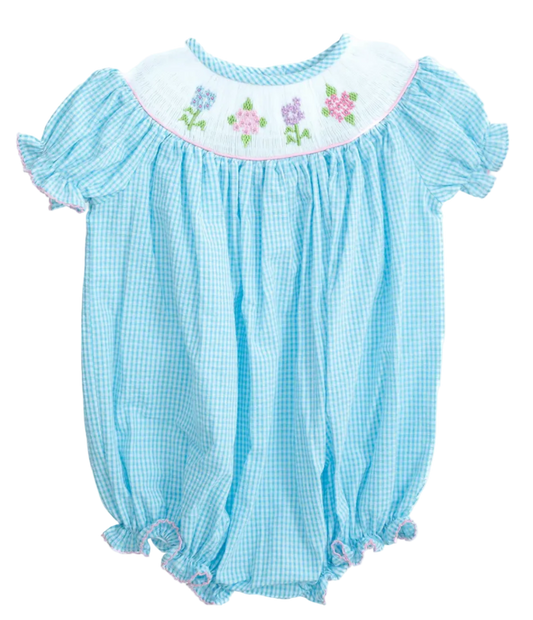 Light blue checkered baby romper with floral embroidery on a white background