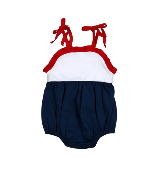 Baby romper with red straps and navy bottom on a white background