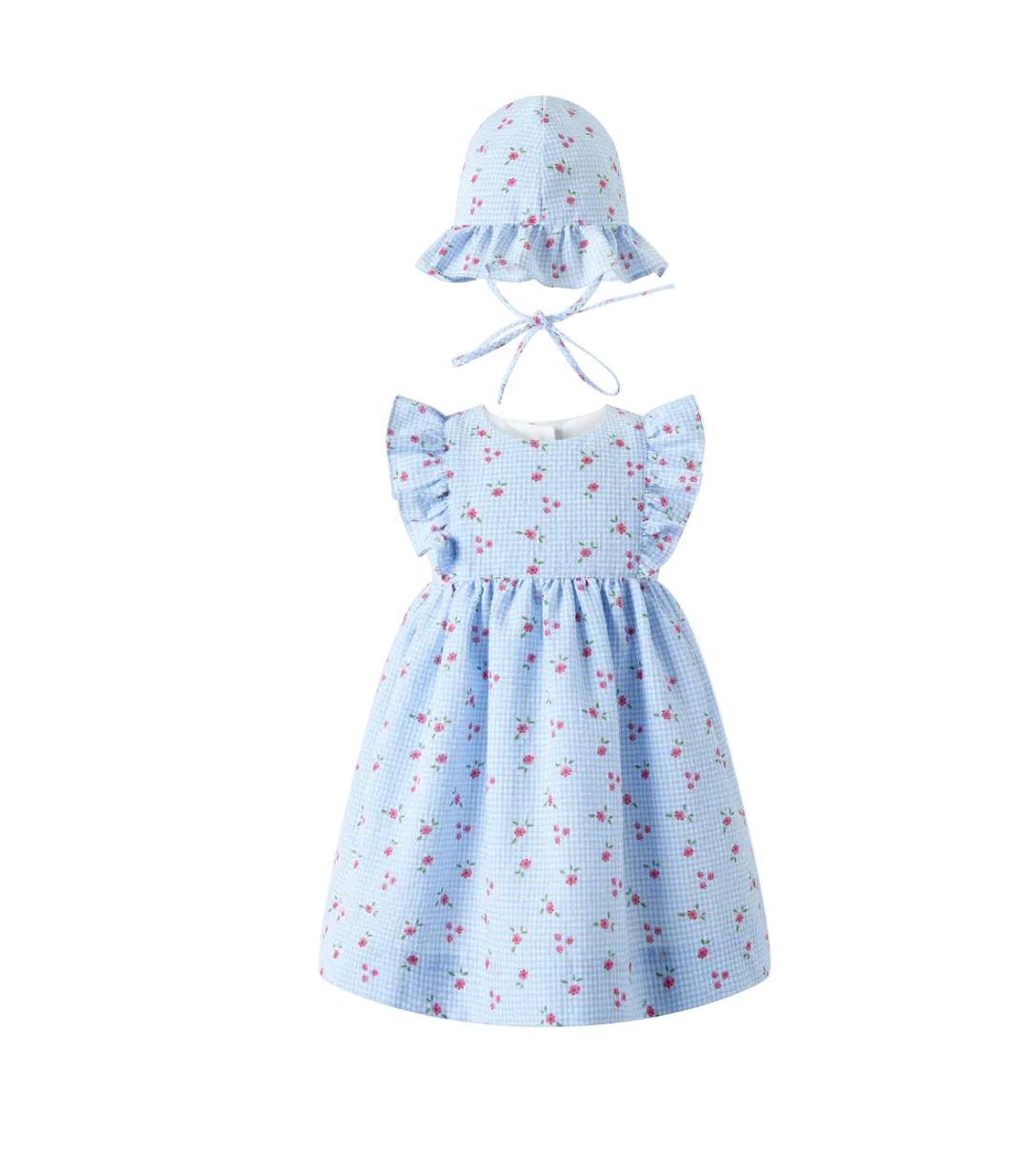 Light blue dress with floral pattern and matching hat on a white background