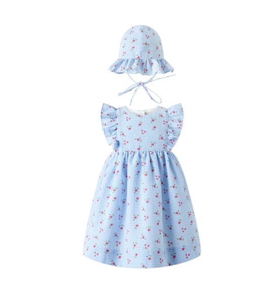 Light blue dress with floral pattern and matching hat on a white background