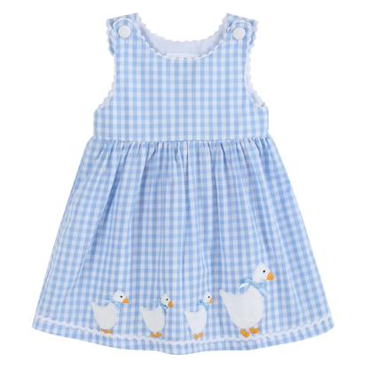 Blue gingham dress with duck appliqués on a white background