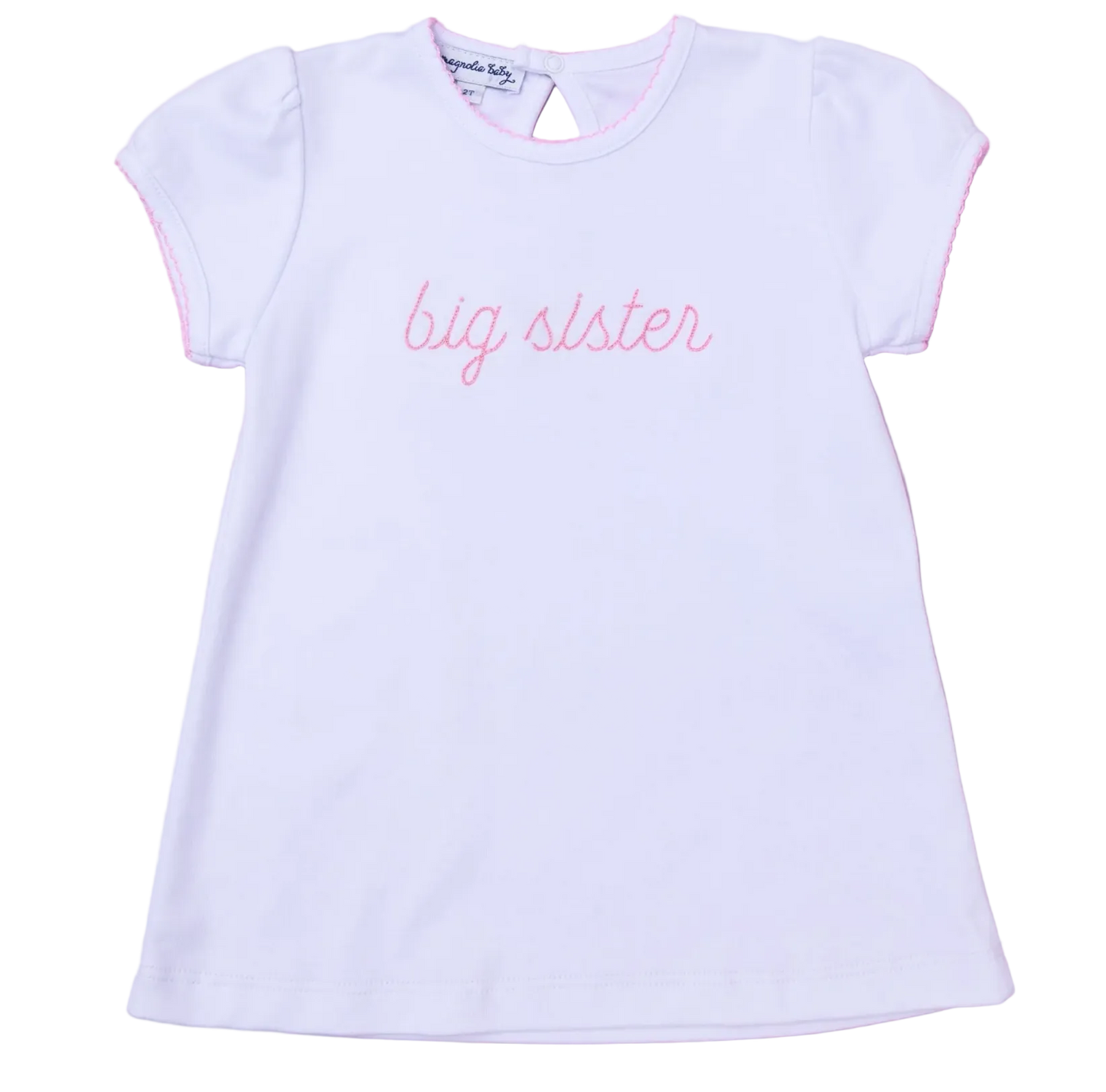 White t-shirt with 'big sister' text on a pink background