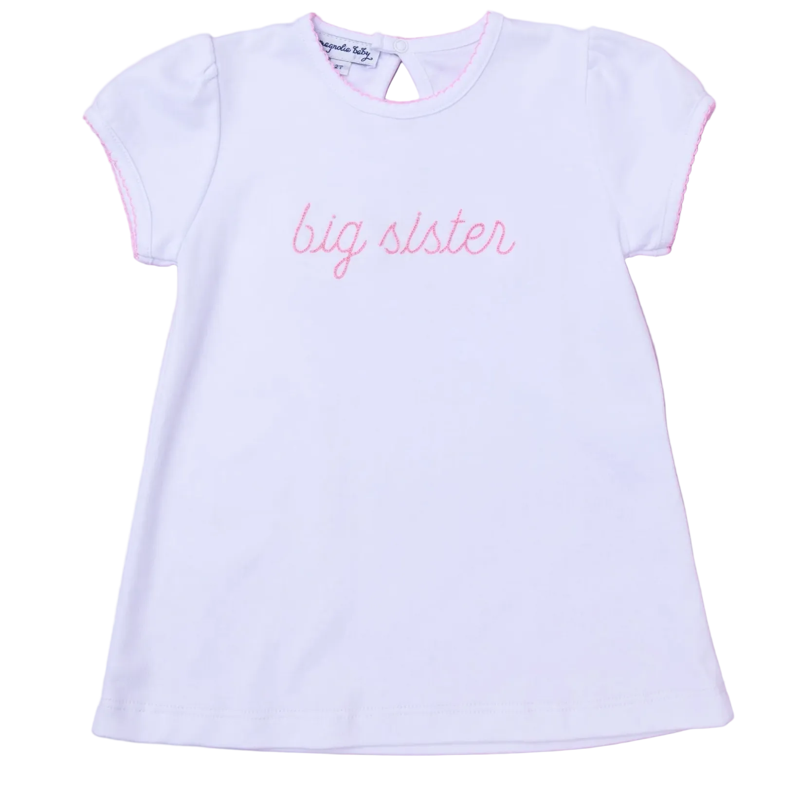 White t-shirt with 'big sister' text on a pink background