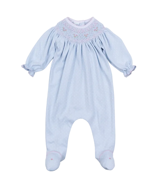 Light blue baby romper with smocked details on a white background