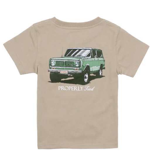 Beige t-shirt with a graphic of a green SUV and 'Properly Tied' text on a white background