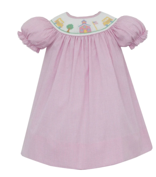 Pink Gingham dress with embroidered top that features back to school details on a white background