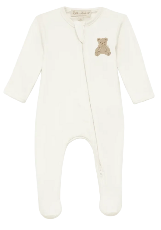 White baby onesie with a teddy bear patch on a white background