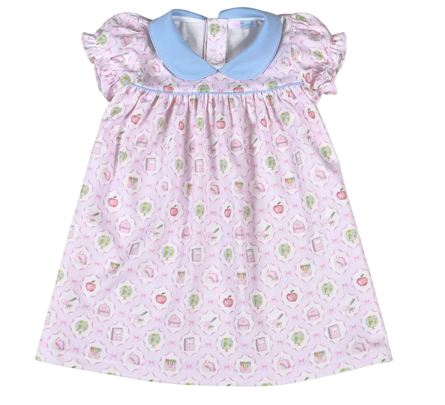 Baby dress with a light pink pattern with back to school supplies and on a white background