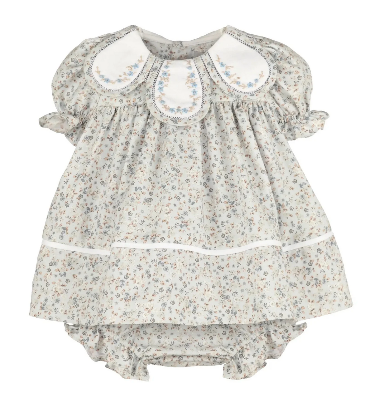 A baby girl's short-sleeve dress with a delicate beige and blue floral print, featuring a white Peter Pan collar with blue embroidery, a ruffled tiered skirt, and a matching ruffled bloomers bottom.
