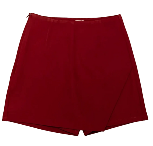 A Maroon wrap-style skirt with a high waist and asymmetrical front seam, shown flat against a plain white background.