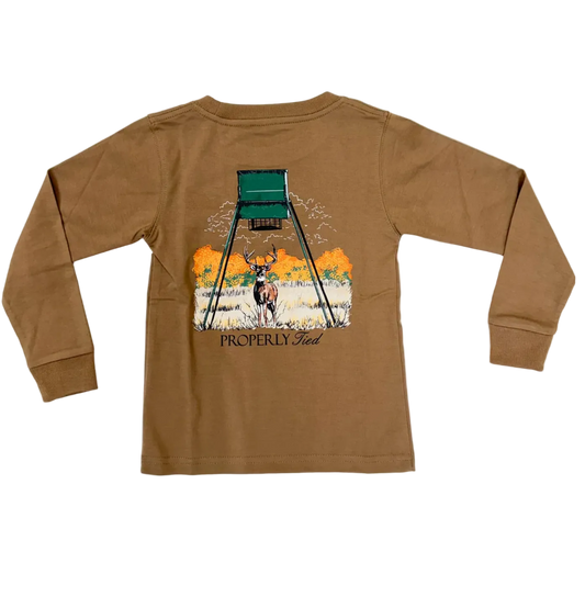 A brown long-sleeve t-shirt laid flat on a white background, showing the back graphic which features a deer under a hunting stand with the text 'PROPERLY CLEARED'.