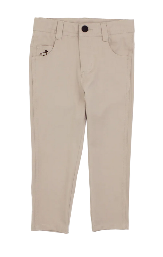 A pair of beige slim-fit pants for kids, featuring a button closure, belt loops, front pockets, and a small embroidered logo on the left pocket, shown against a plain white background.