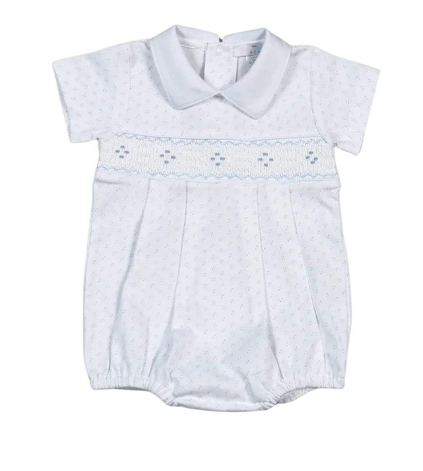 A baby boy's short-sleeve smocked romper in white with a light blue dotted pattern and a smocked chest band.