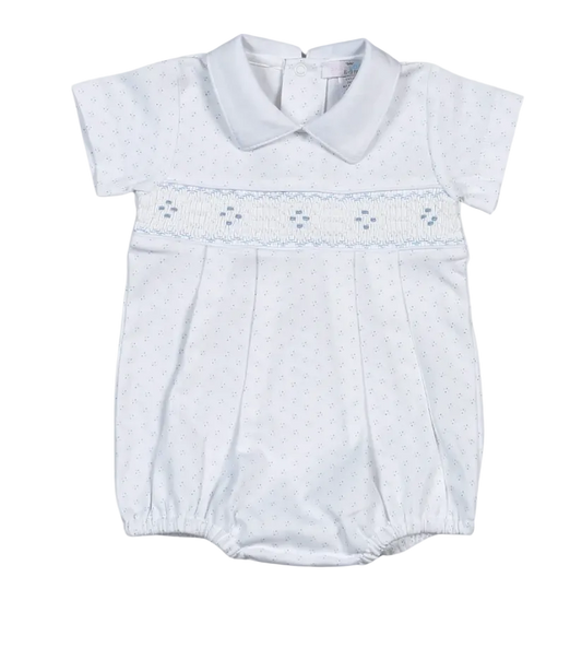A baby boy's short-sleeve smocked romper in white with a light blue dotted pattern and a smocked chest band.